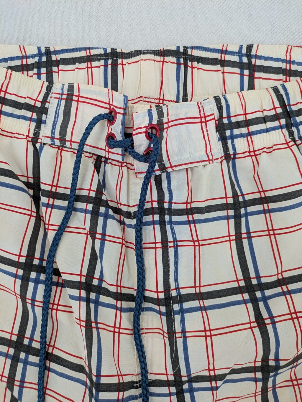 Crivit multi-coloured board shorts with classic check pattern and adjustable drawstring waistband.