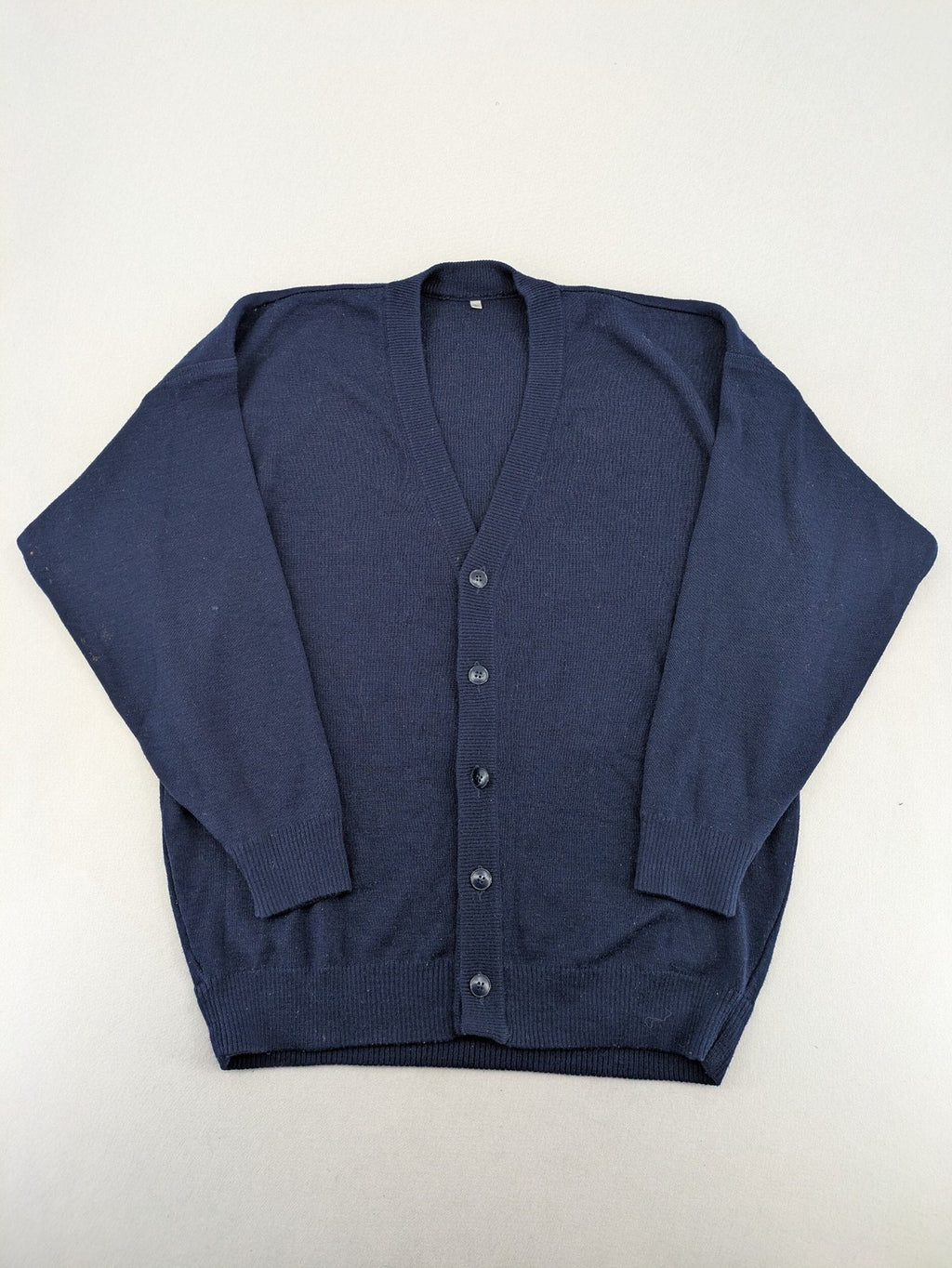 Schurwolle navy knit jumper classic V-neck with button placket, made from wool blend.