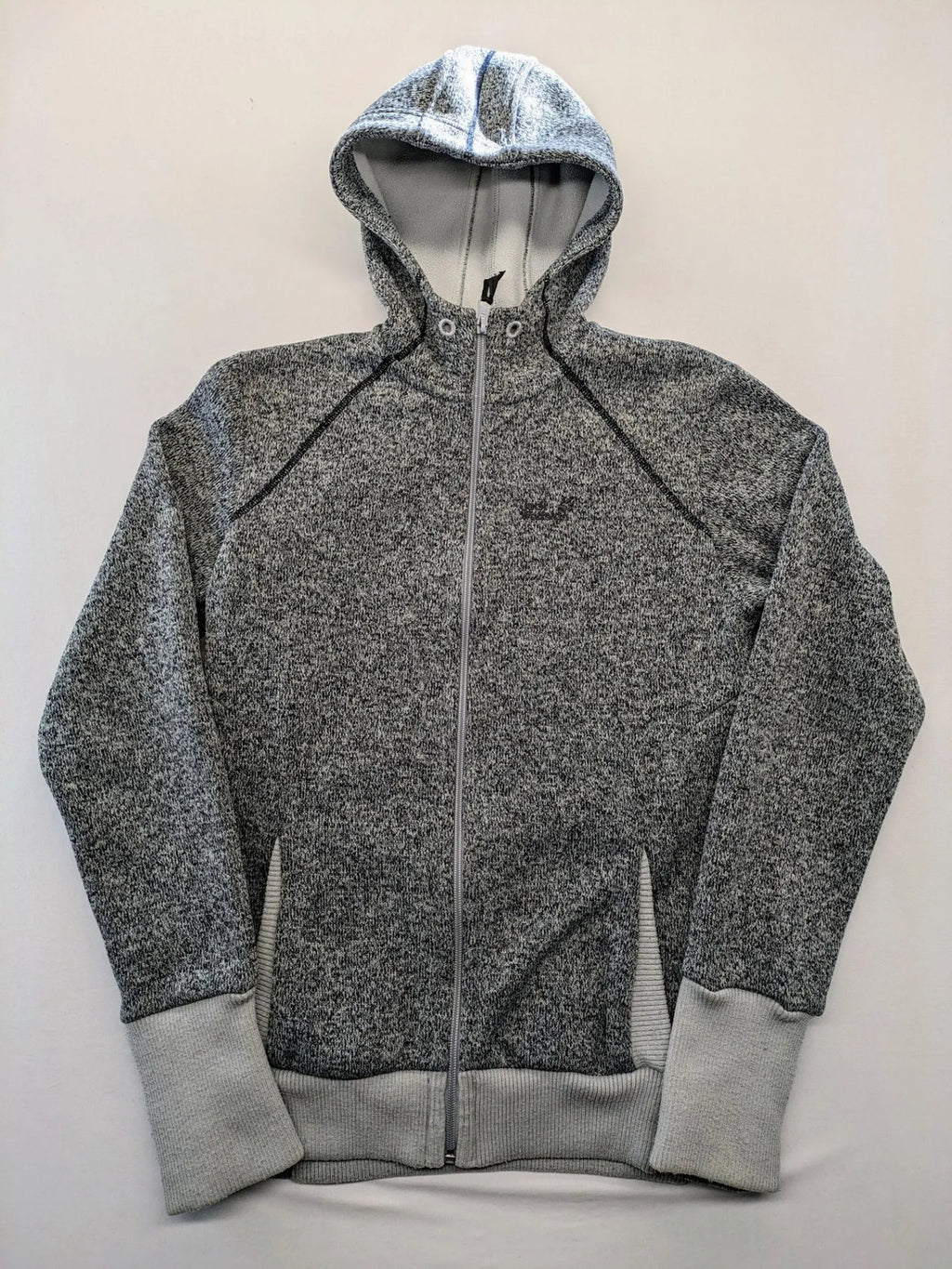 Jack Wolfskin grey fleece jacket with logo detailing and two front pockets.