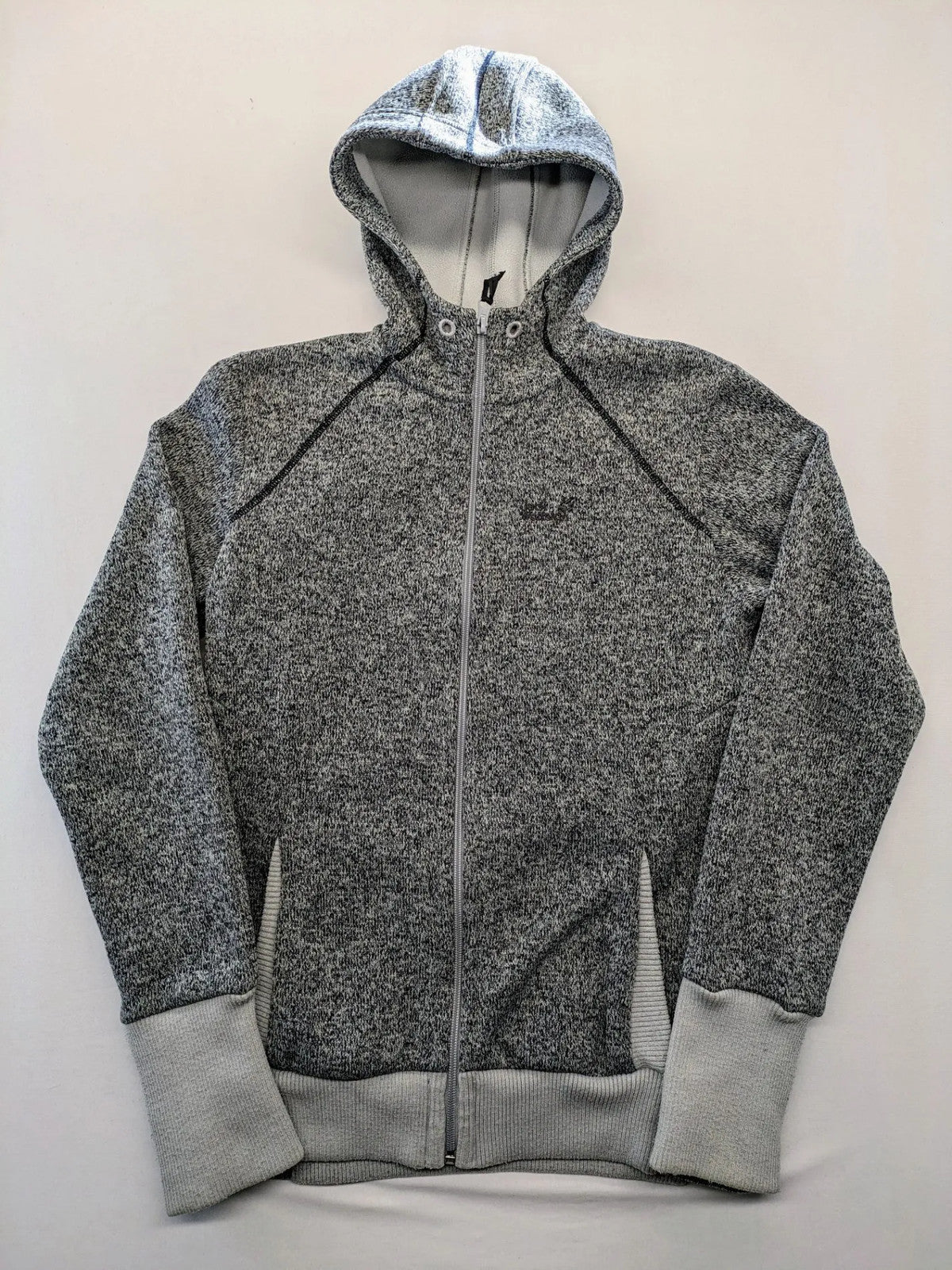 Jack Wolfskin grey fleece jacket with logo detailing and two front pockets.