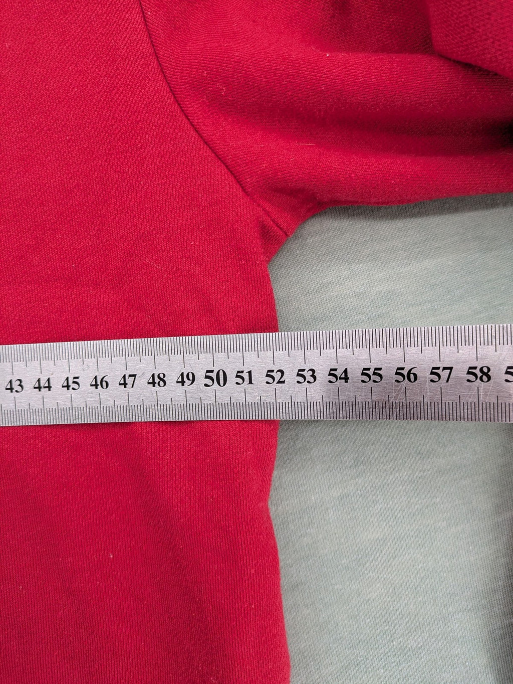 Sparks red zip-through hoodie with New York graphic print and grey hood.