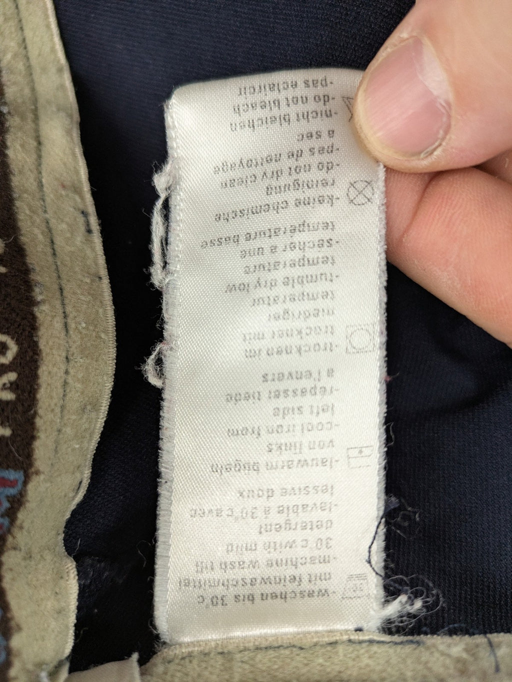 H&KM beige riding pants with dark blue full seat and front zippers.