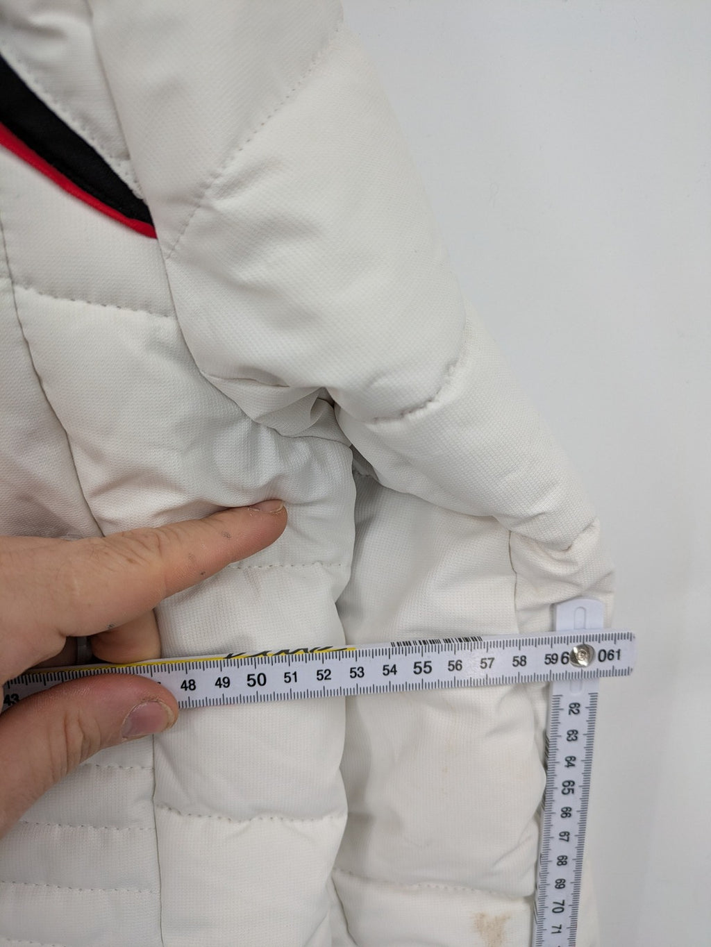 Janina white puffer jacket with quilted design and faux fur hood accents.