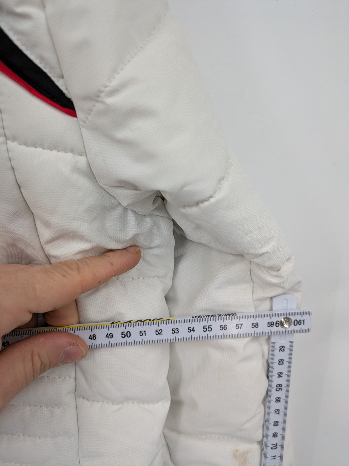 Janina white puffer jacket with quilted design and faux fur hood accents.