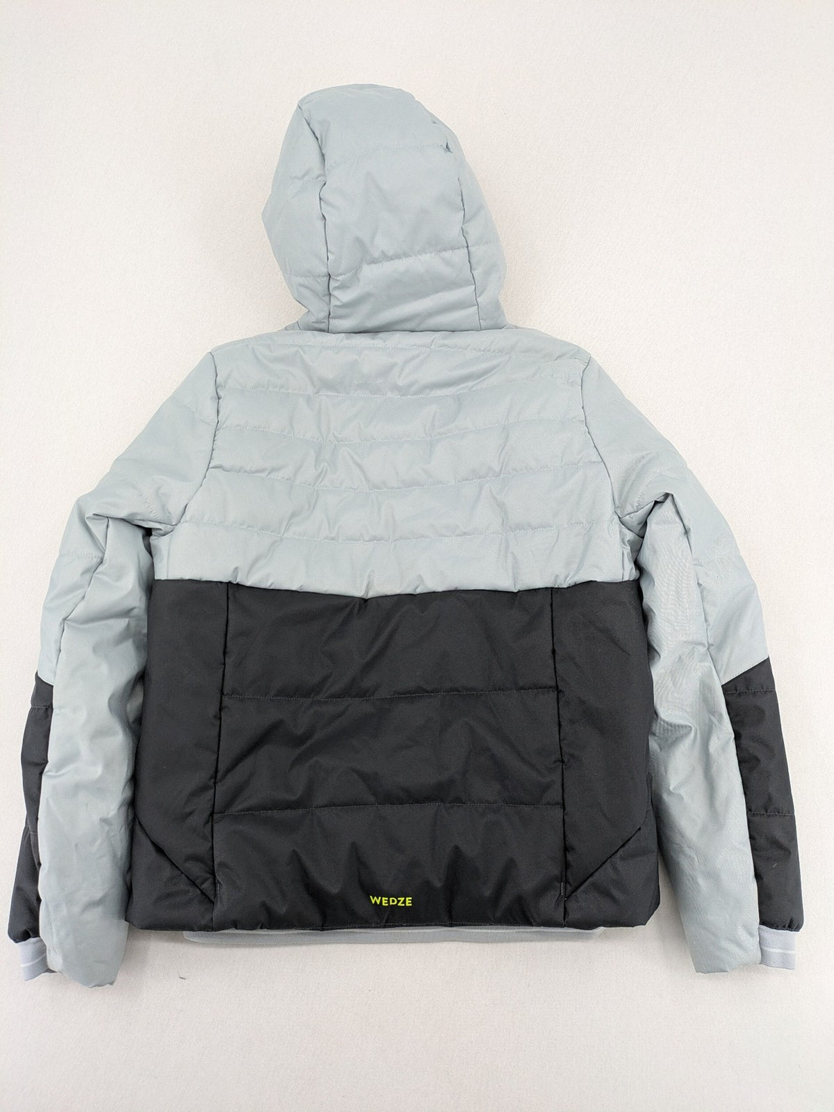 Wedze ski coat grey and black colorblock design with neon accents and fleece lining.