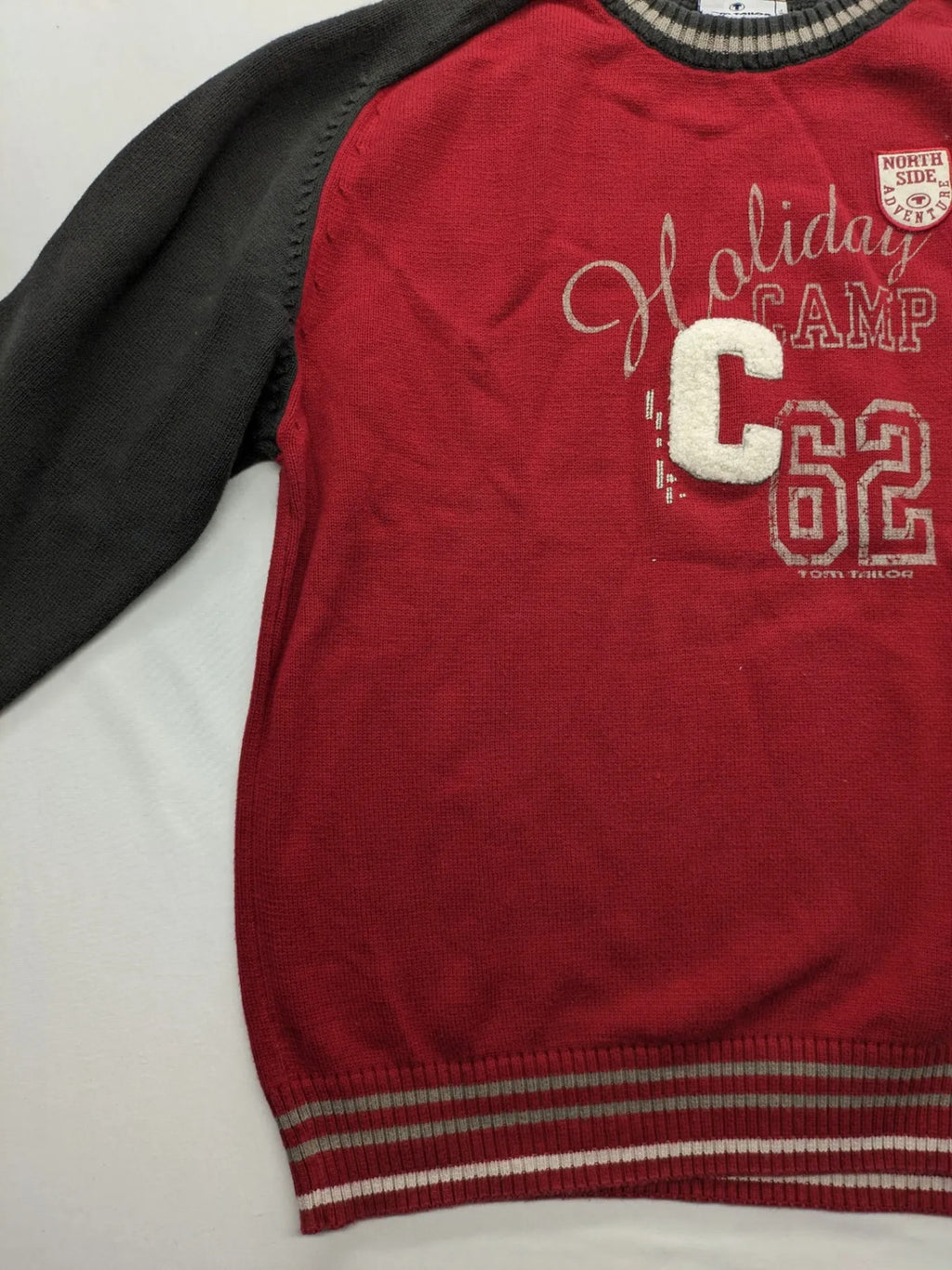 Tom Tailor black and red turtle neck jumper with "Holiday Camp" chenille patch and striped cuffs.