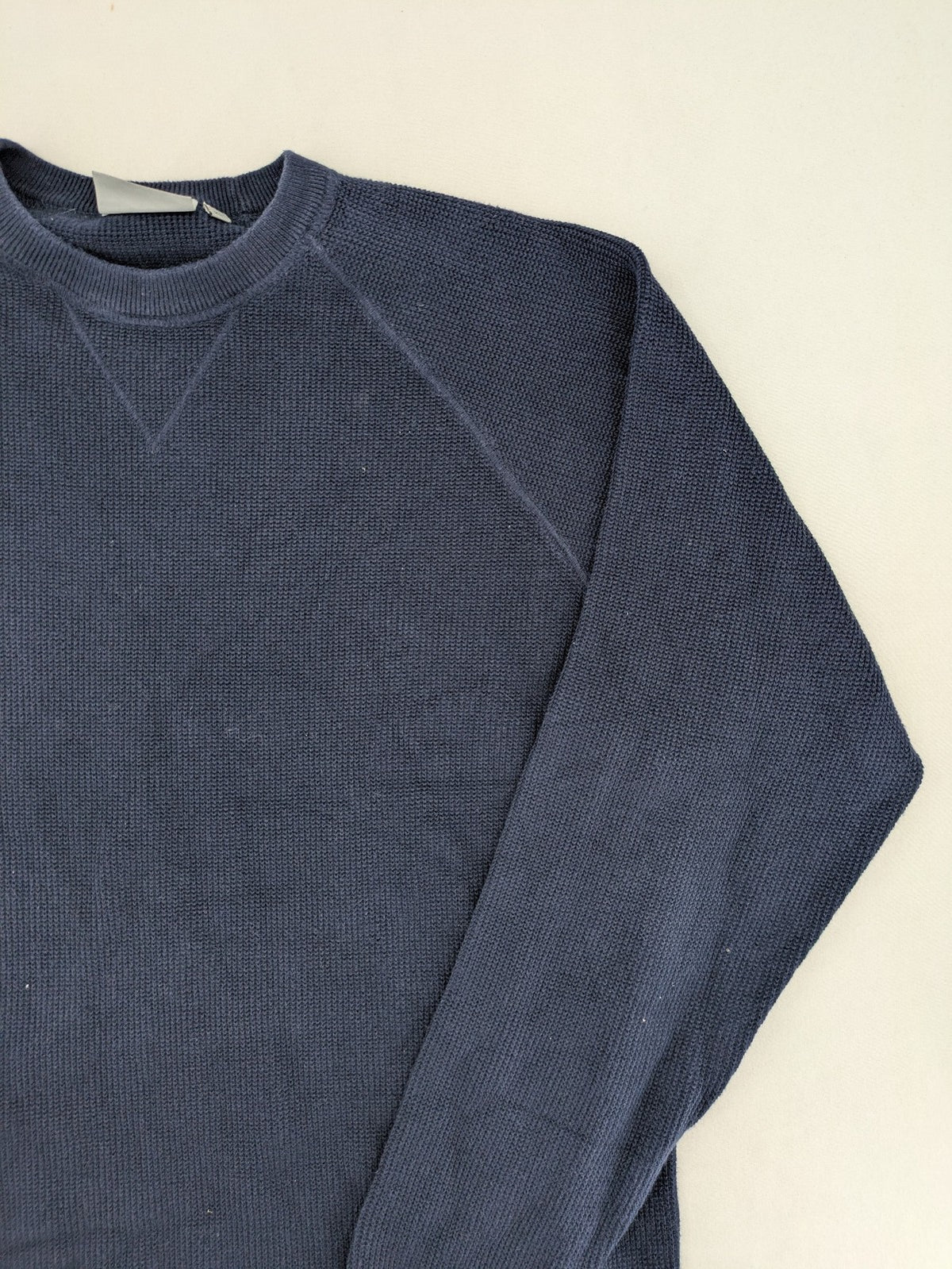 Carhartt navy turtle neck jumper waffle knit texture with subtle logo on sleeve.