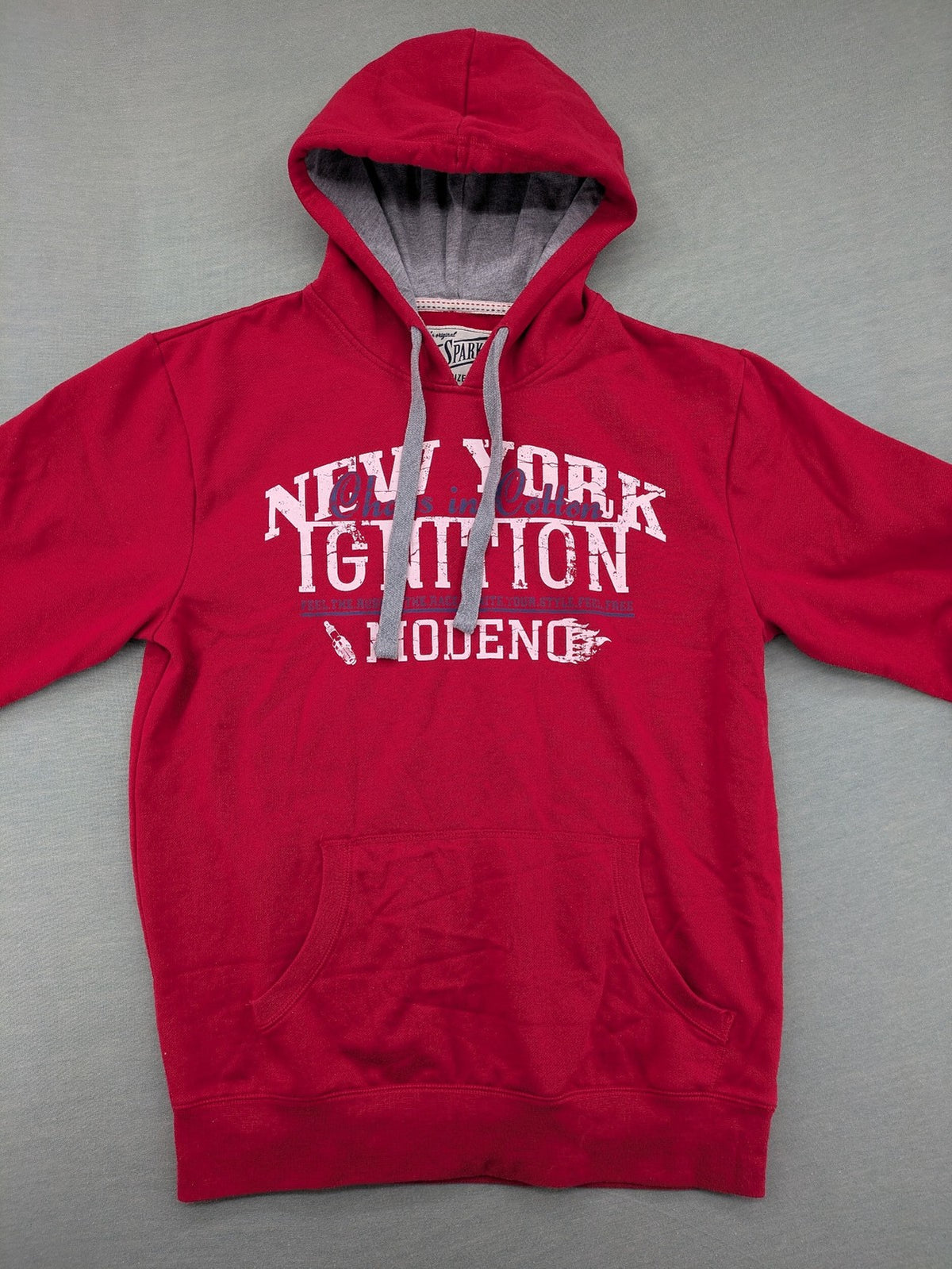 Sparks red zip-through hoodie with New York graphic print and grey hood.
