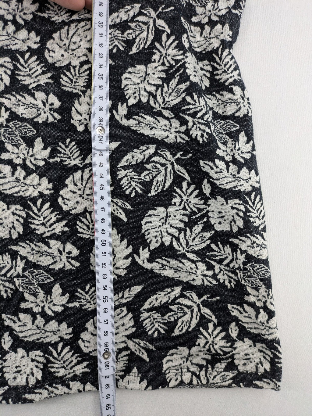 Zara Man black and white t-shirt with allover leaf print and textured knit fabric.