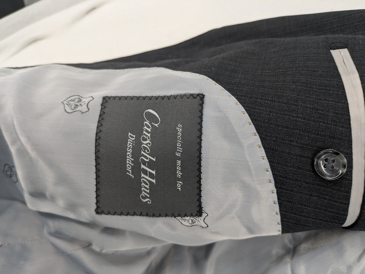 Desch grey blazer with dark grey pinstripe pattern, satin lining, and tailored design.