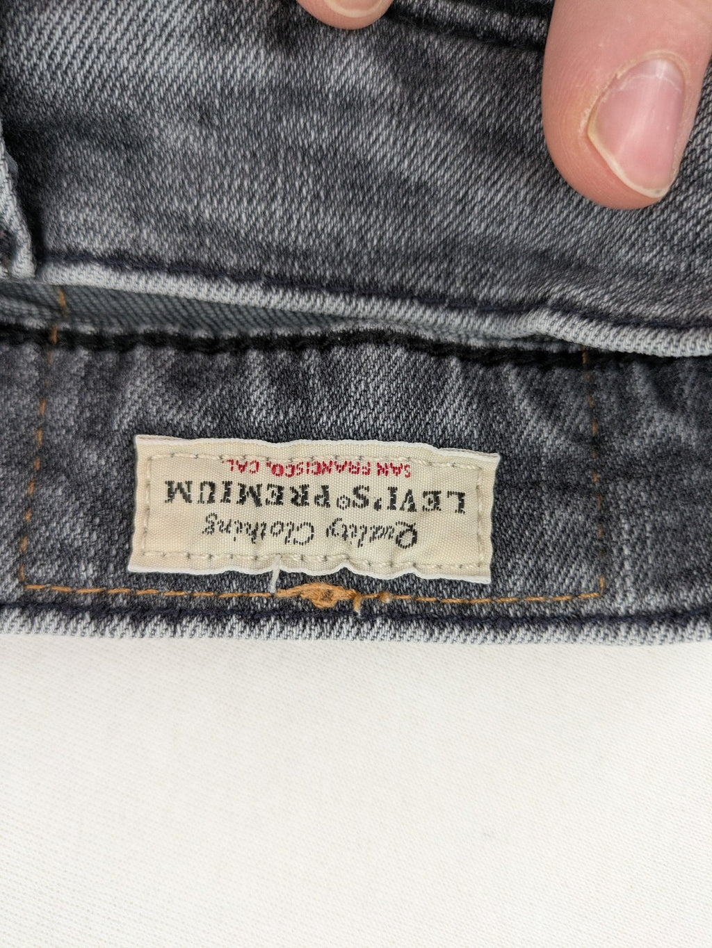 Levi's red straight jeans with classic 5-pocket design and slim taper fit.