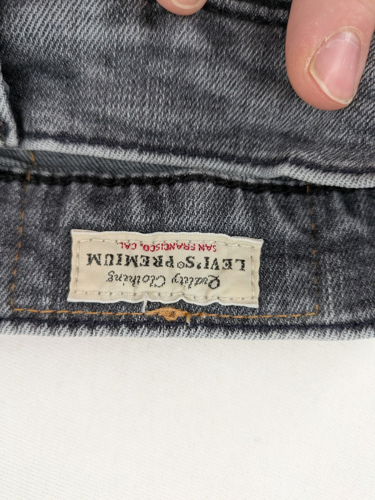Levi's red straight jeans with classic 5-pocket design and slim taper fit.