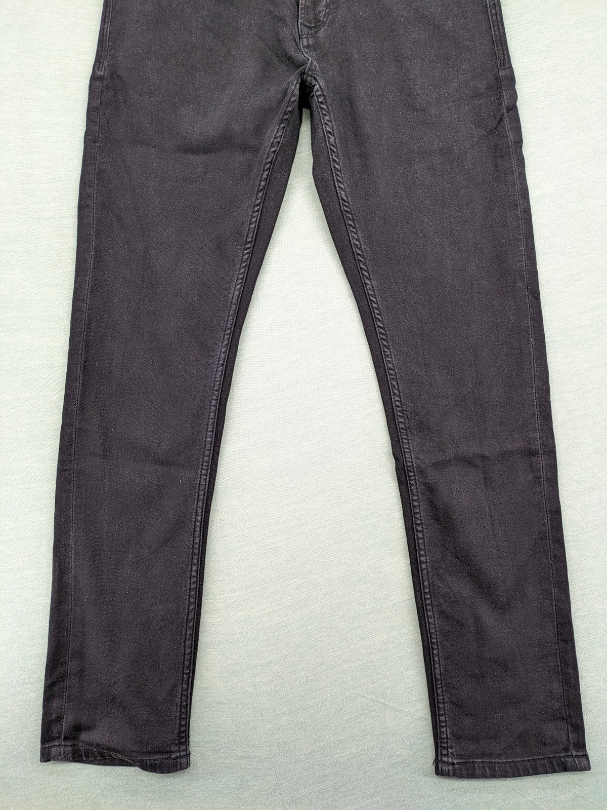 Savvy black straight jeans with washed finish and slim fit, made from stretch denim.