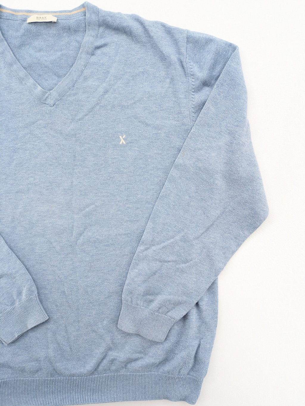 BRAX blue turtle neck jumper with V-neck and subtle "X" logo embroidery.