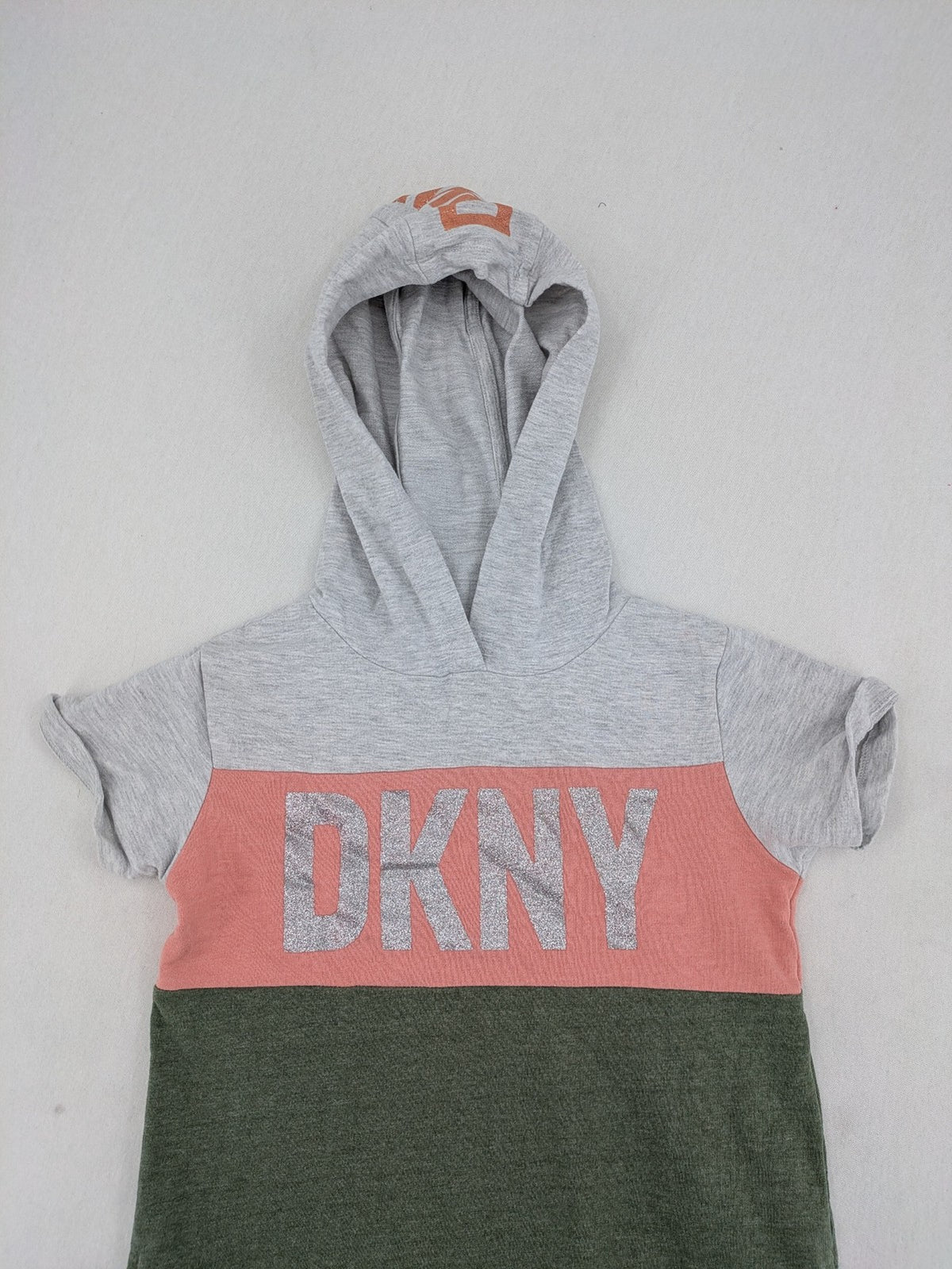 DKNY pink hoodie dress colorblock design with glitter logo and short sleeves.