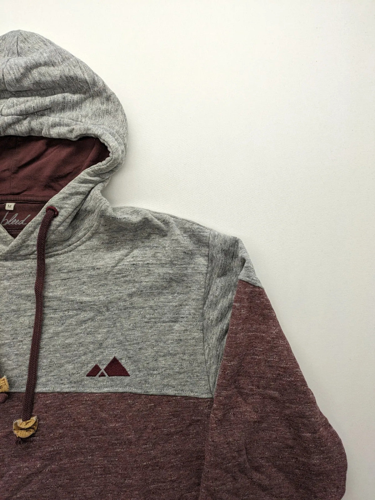 Bleed turtle neck jumper grey burgundy colorblock design with adjustable hood and kangaroo pocket.