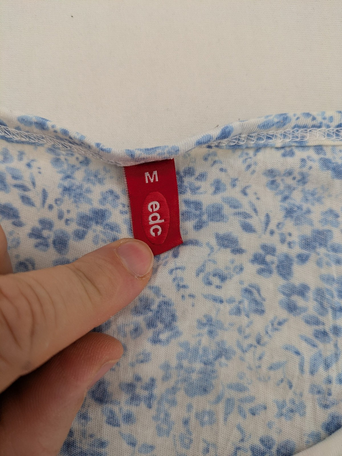 edc blue and white floral top short sleeve gathered neckline decorative eyelets