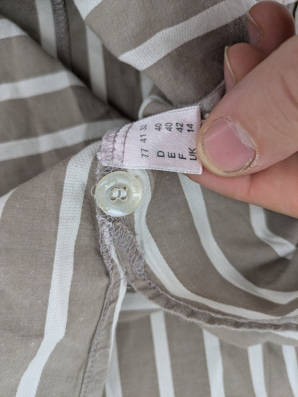 Body Sunday beige and white striped loungewear top with bow accents and button placket.