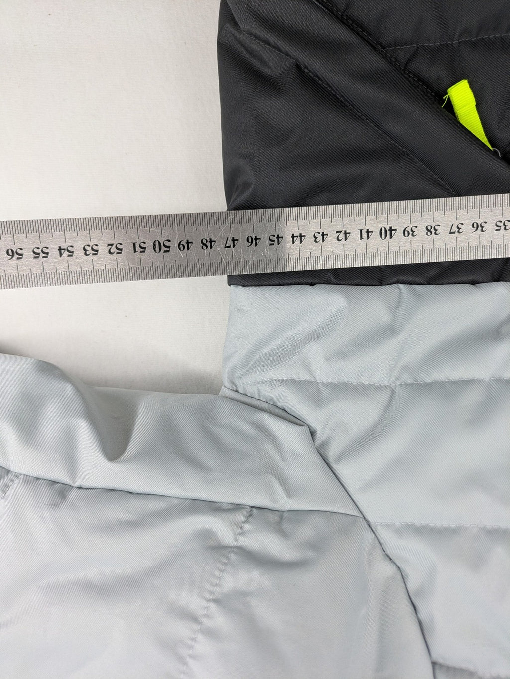 Wedze ski coat grey and black colorblock design with neon accents and fleece lining.