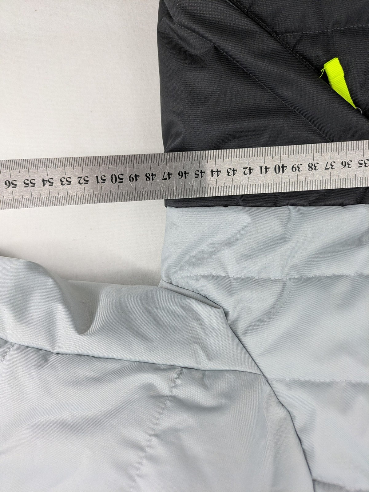 Wedze ski coat grey and black colorblock design with neon accents and fleece lining.