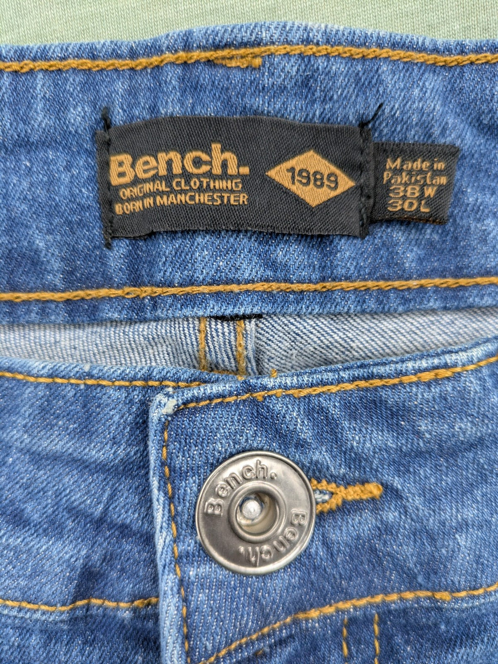 Bench blue straight jeans with reinforced knees and multiple cargo pockets.