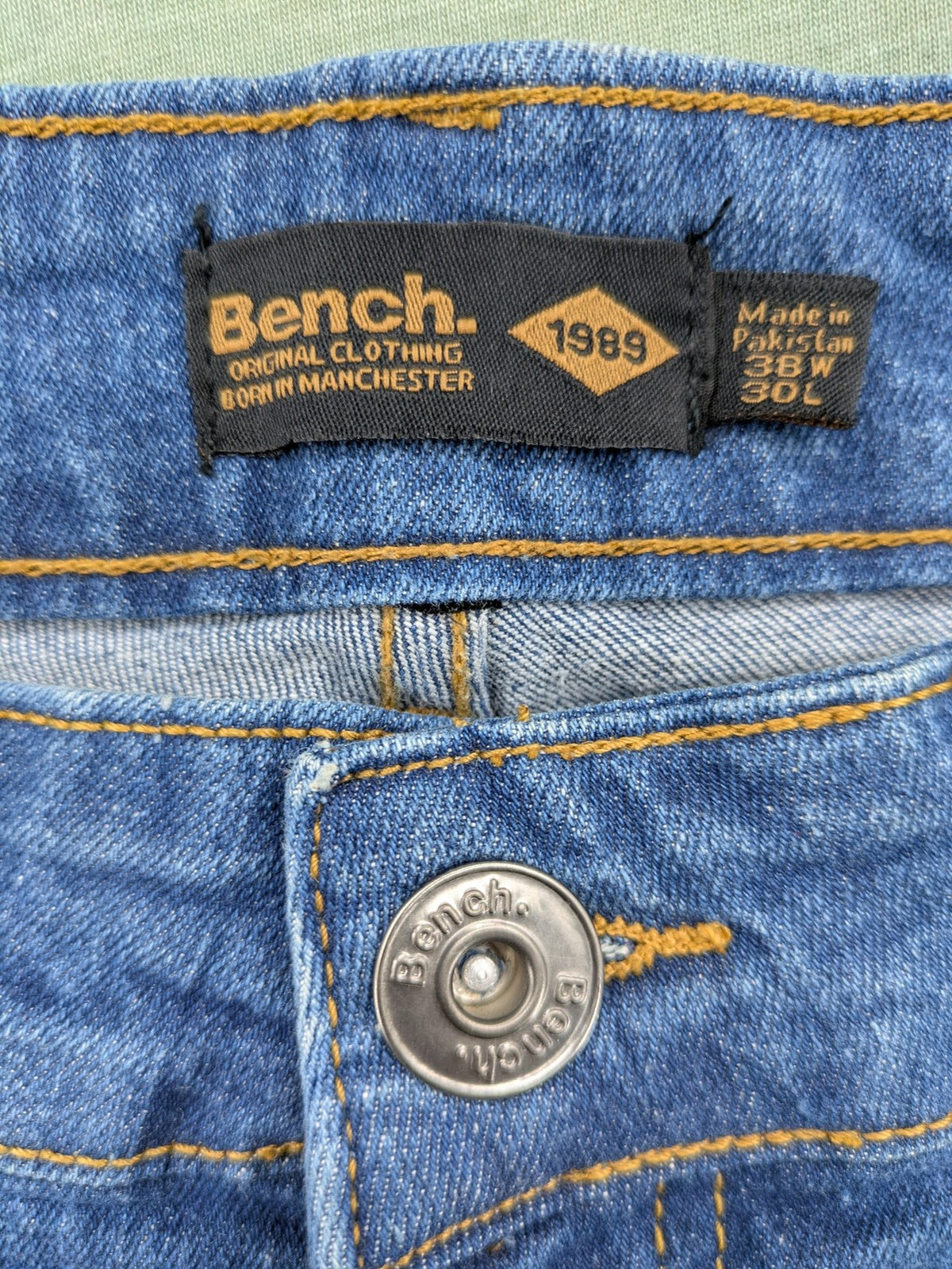 Bench blue straight jeans with reinforced knees and multiple cargo pockets.