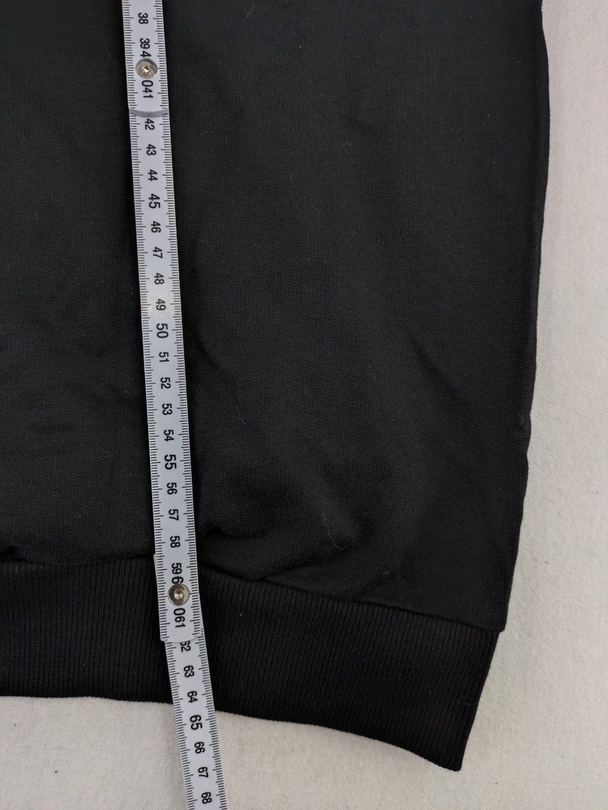LC Waikiki black turtle neck jumper featuring Atatürk graphic print and signature.