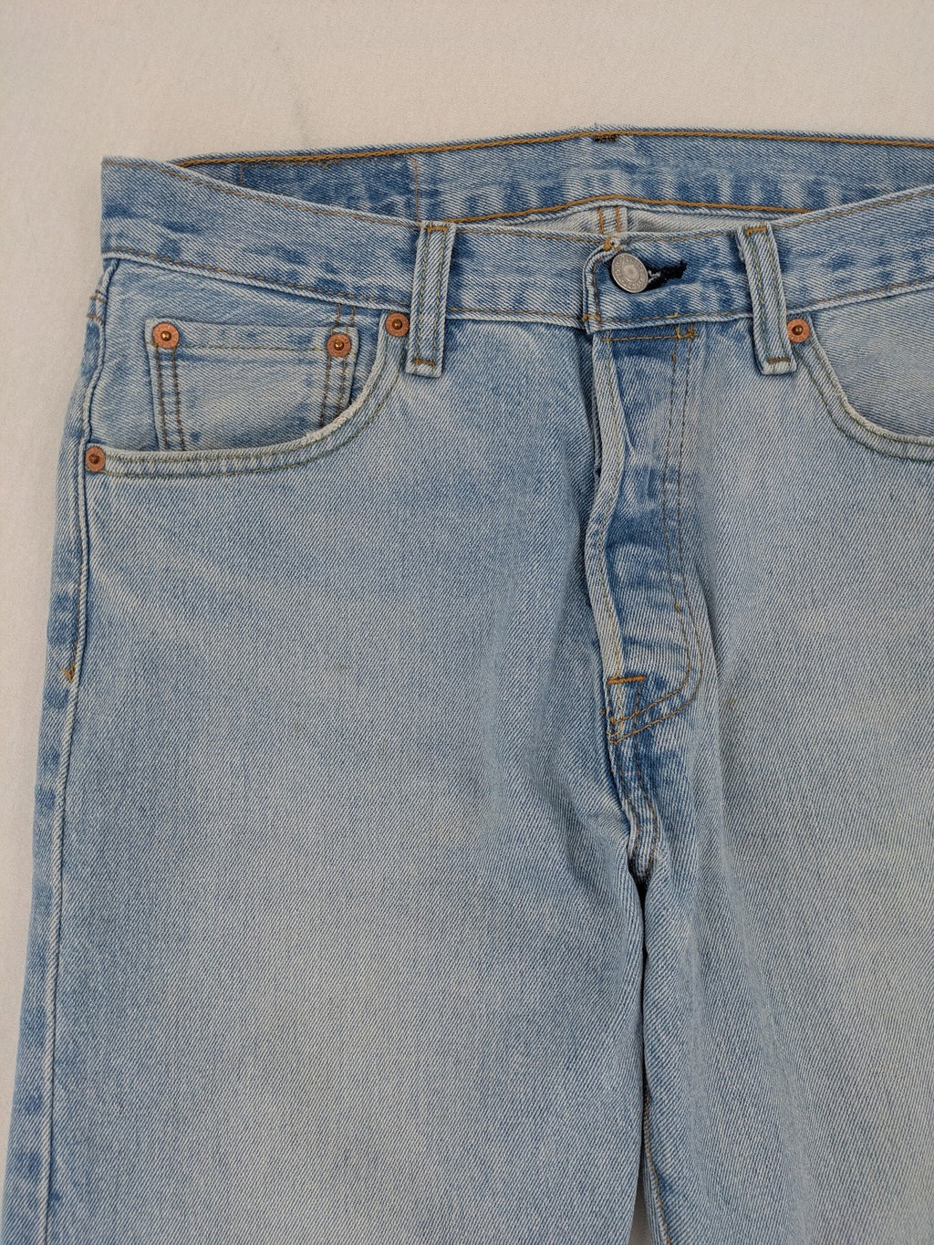 Levi's blue straight jeans light wash denim with button fly and classic fit.