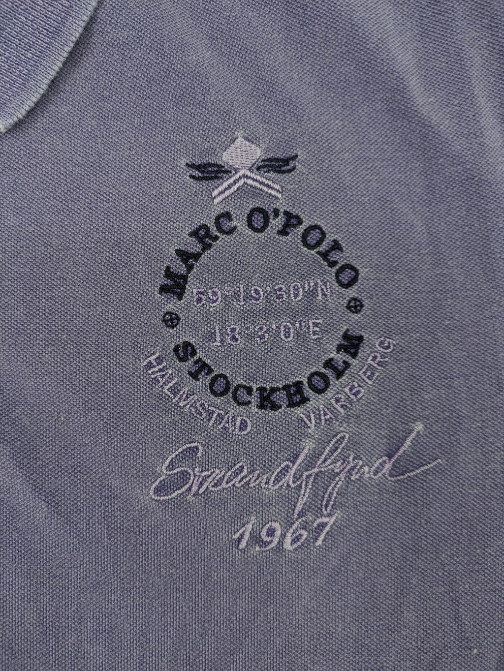 Marc O'Polo purple polo shirt garment dyed cotton with embroidered logo and intricate details.