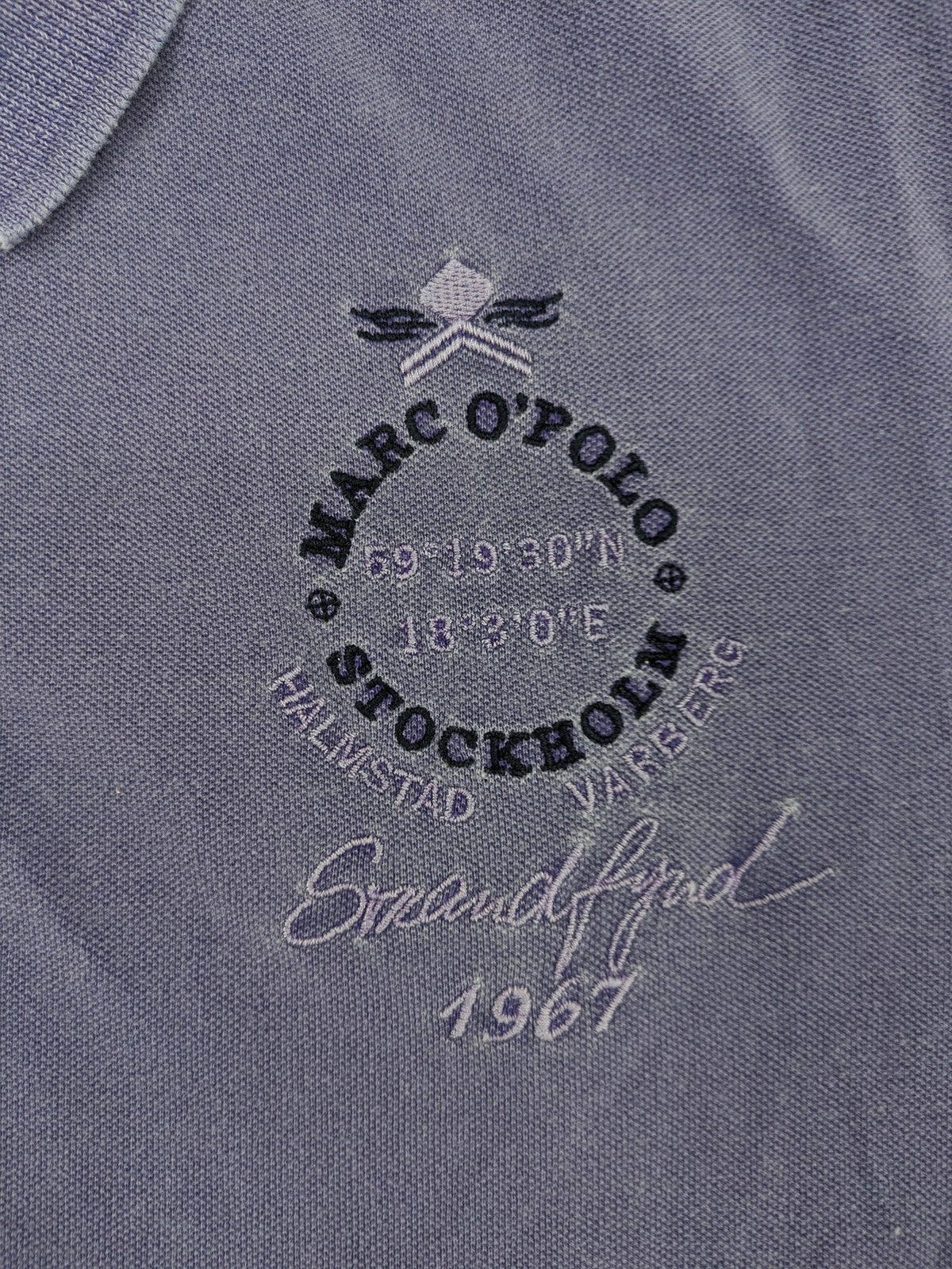 Marc O'Polo purple polo shirt garment dyed cotton with embroidered logo and intricate details.