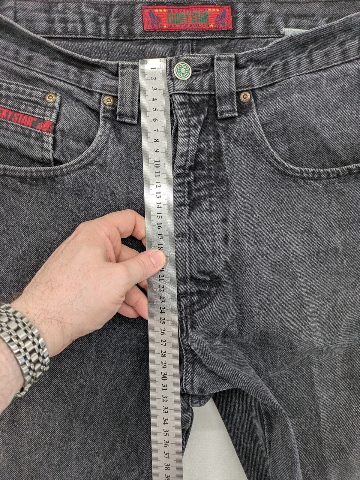 Lucky Star grey tapered high waist jeans with faded wash and red logo details.