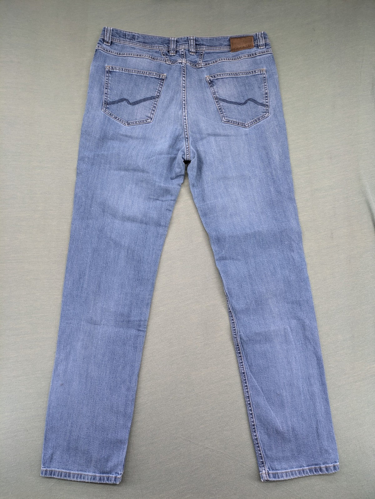 Bugatti blue straight jeans with classic 5-pocket design and light wash denim.