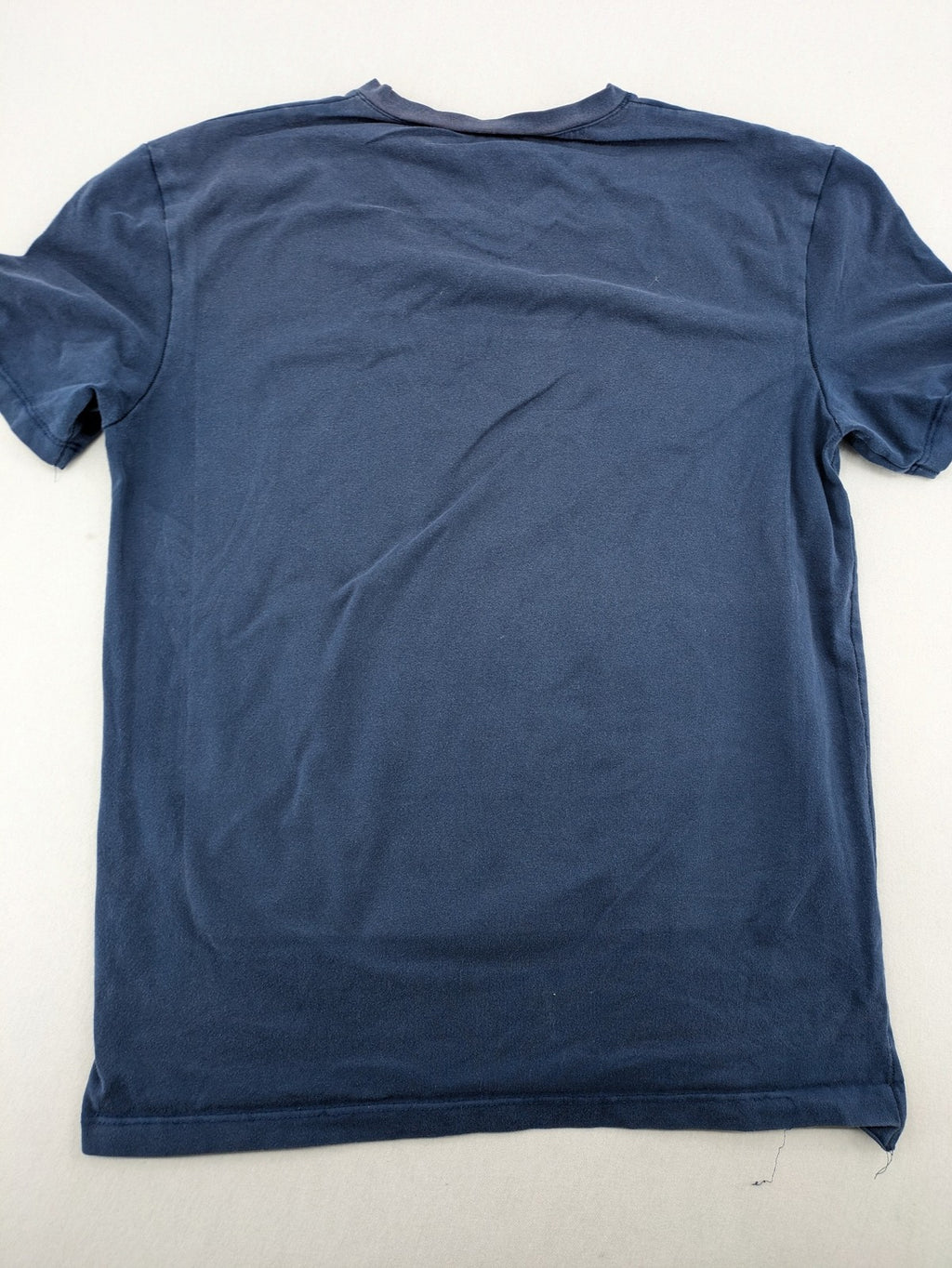 G-Unit navy vintage T-shirt with vertical logo print and V-neck design.