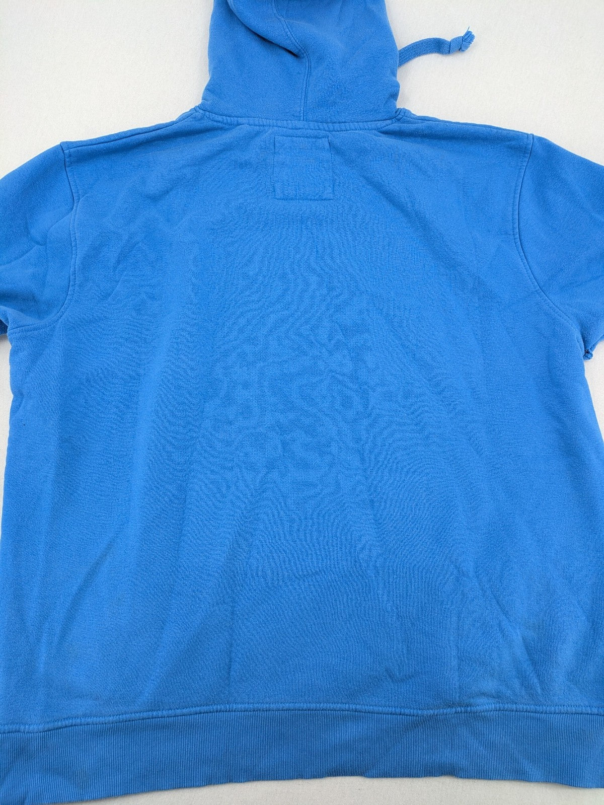 Masters of the Universe blue zip-through hoodie featuring large He-Man logo and drawstring hood.