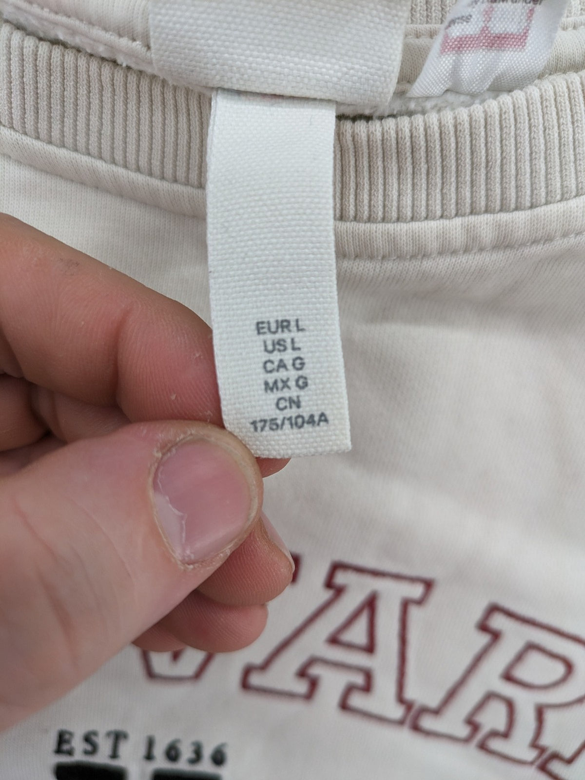 H&M cream turtle neck jumper embroidered Harvard University logo, soft cotton blend.
