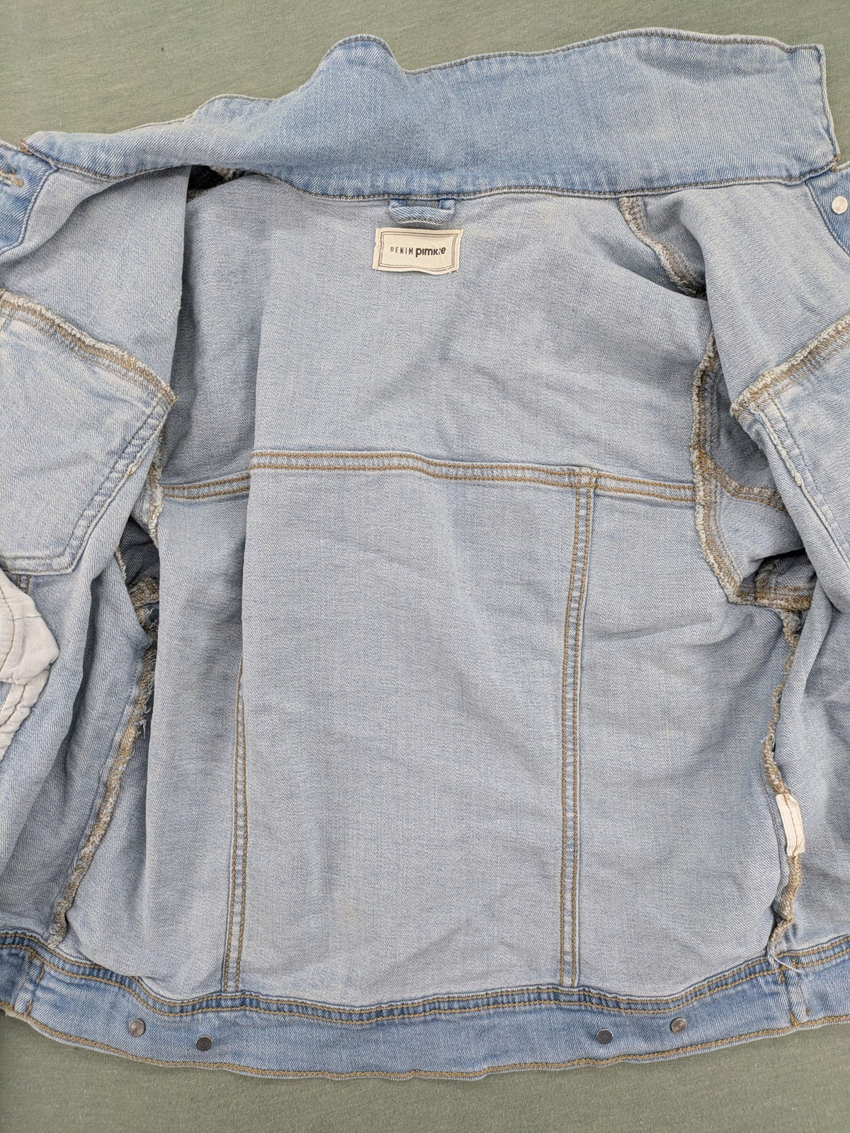 Pimkie blue denim jacket with classic cut, button placket, and two chest pockets.