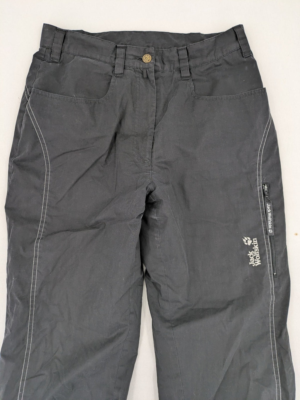Jack Wolfskin grey outdoor pants with embroidered logo and side zip pocket.