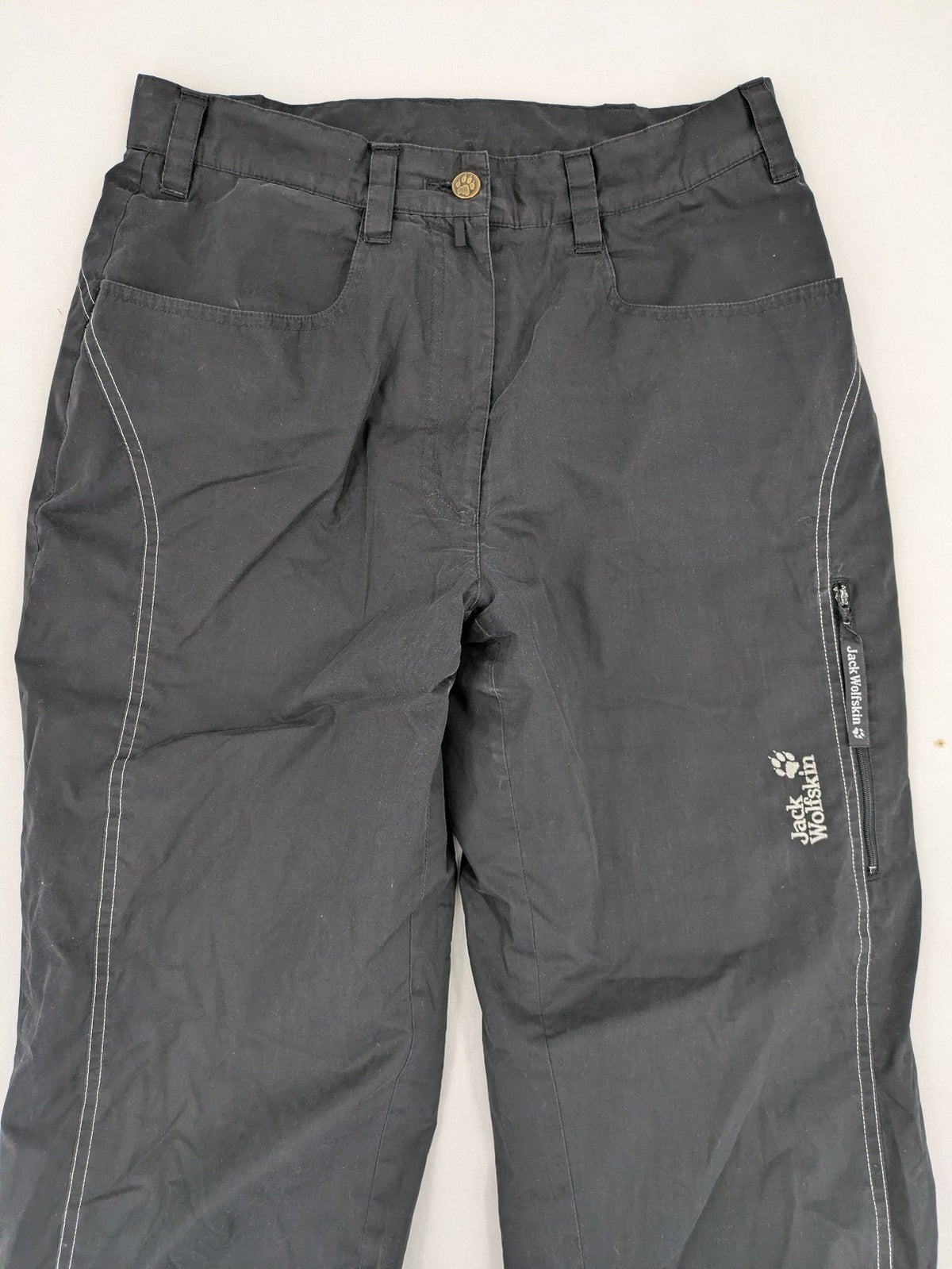 Jack Wolfskin grey outdoor pants with embroidered logo and side zip pocket.