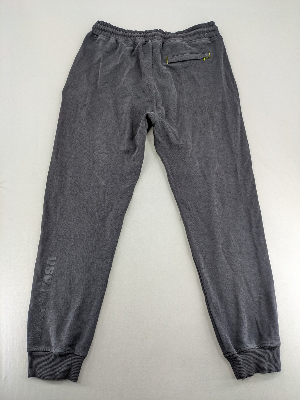 US Polo Assn grey sweatpants with light green drawstring and subtle logo detail.