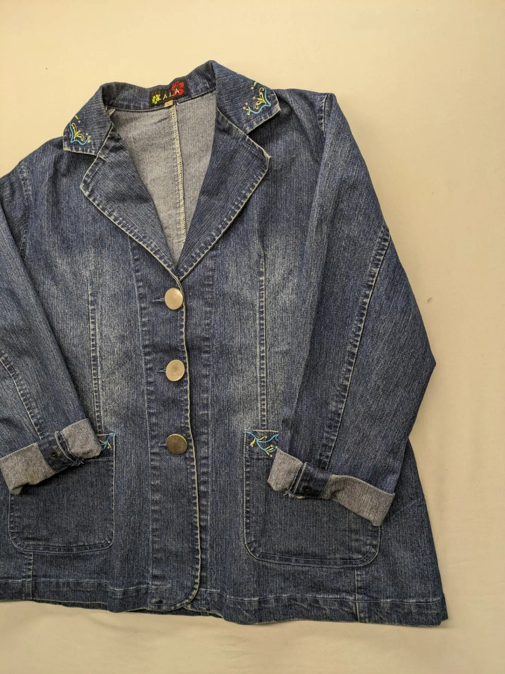 Zala blue denim blazer jacket with embroidered details and classic button closure.