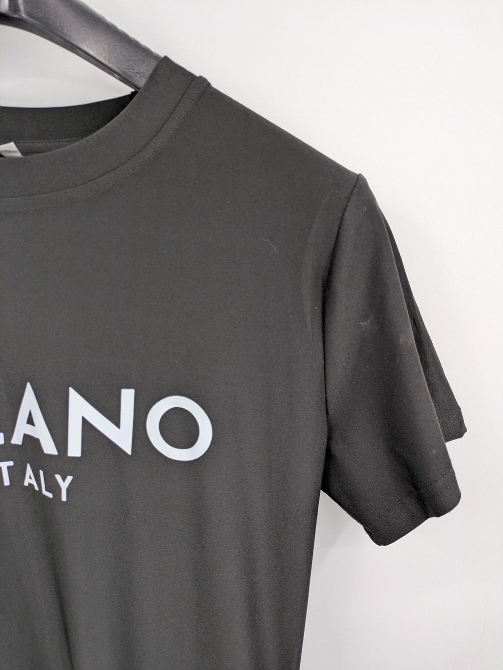 Milano black bodycon T-shirt dress with stylish print and side slit detail.