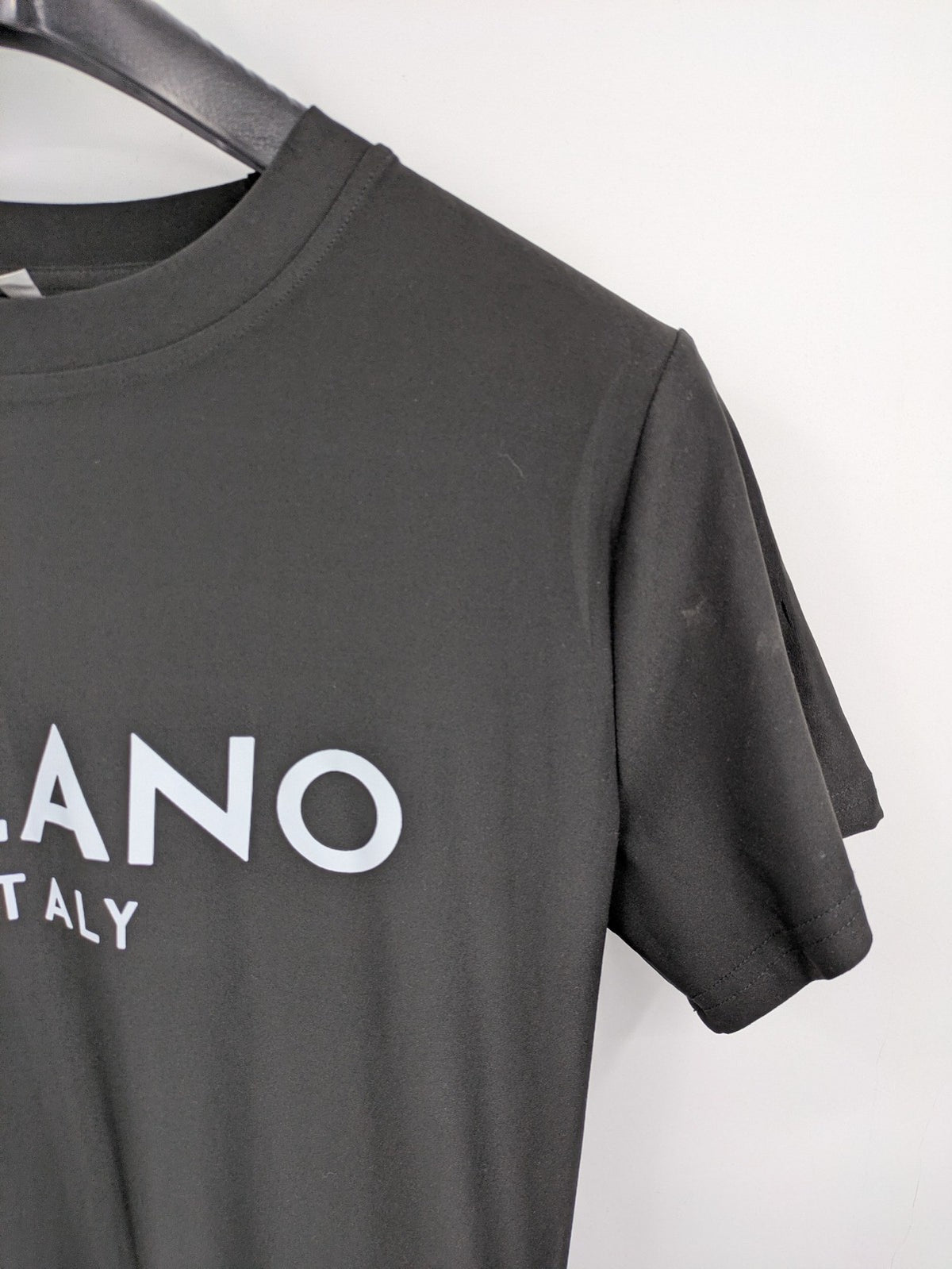 Milano black bodycon T-shirt dress with stylish print and side slit detail.