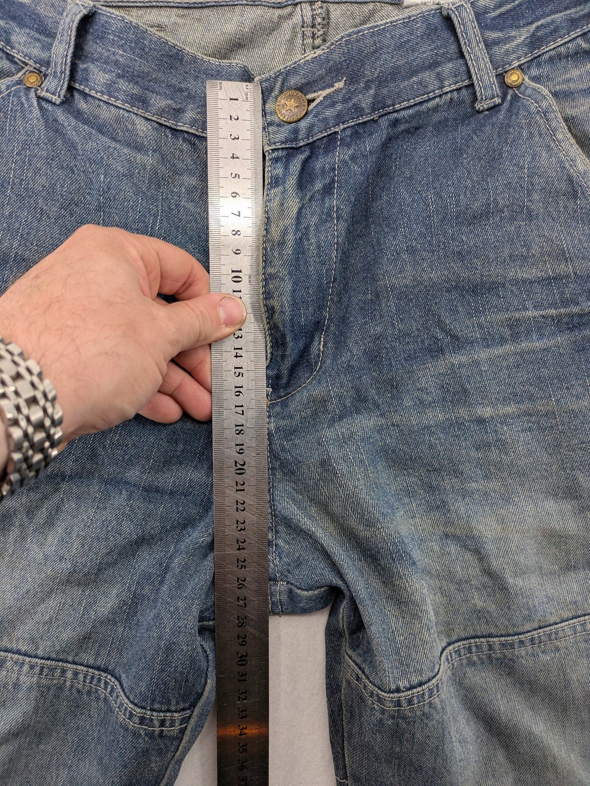 John F. Gee blue straight jeans with reinforced knees and durable denim material.