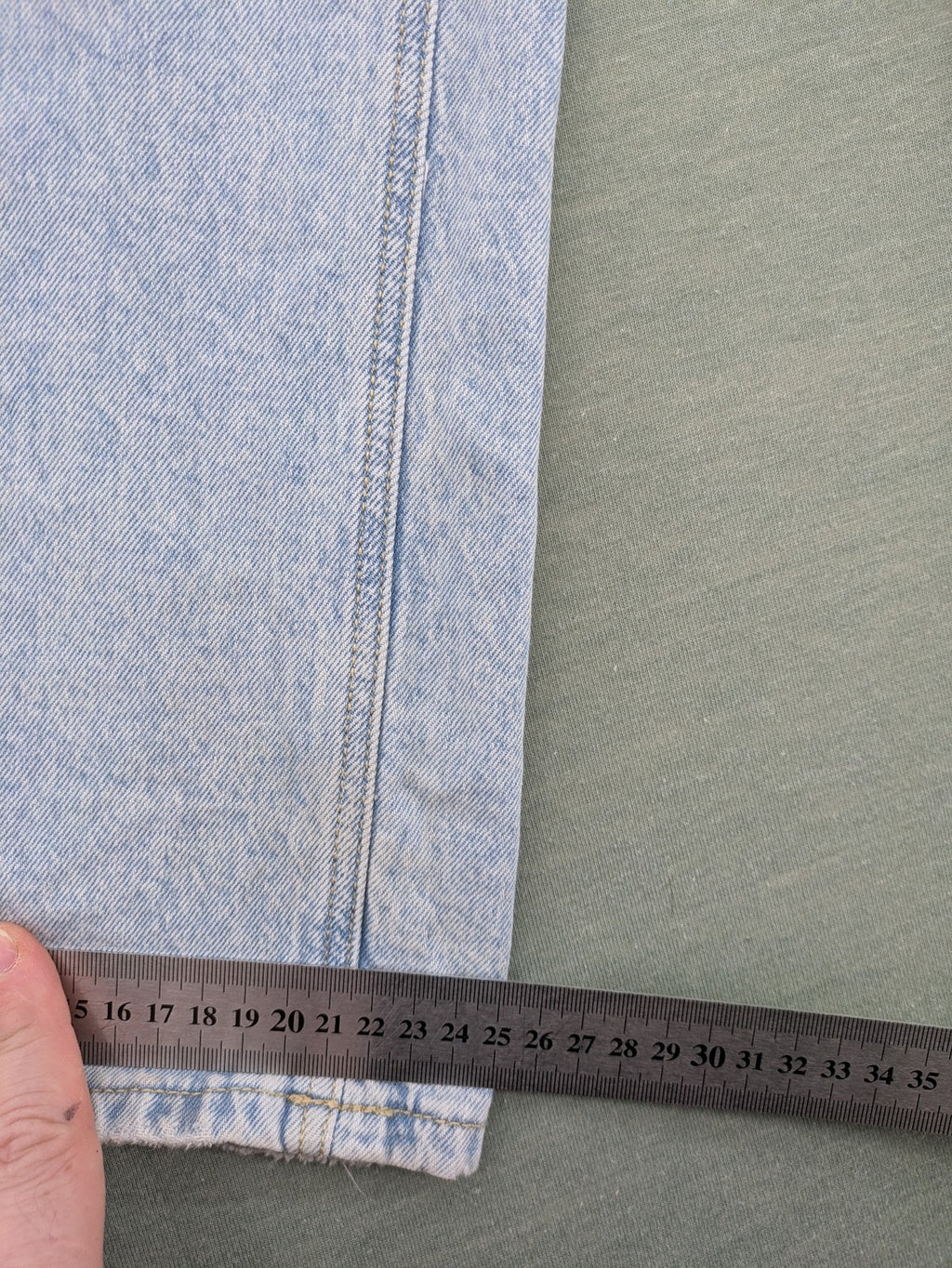 C&A blue wide leg jeans with distressed knee details and classic five-pocket design.