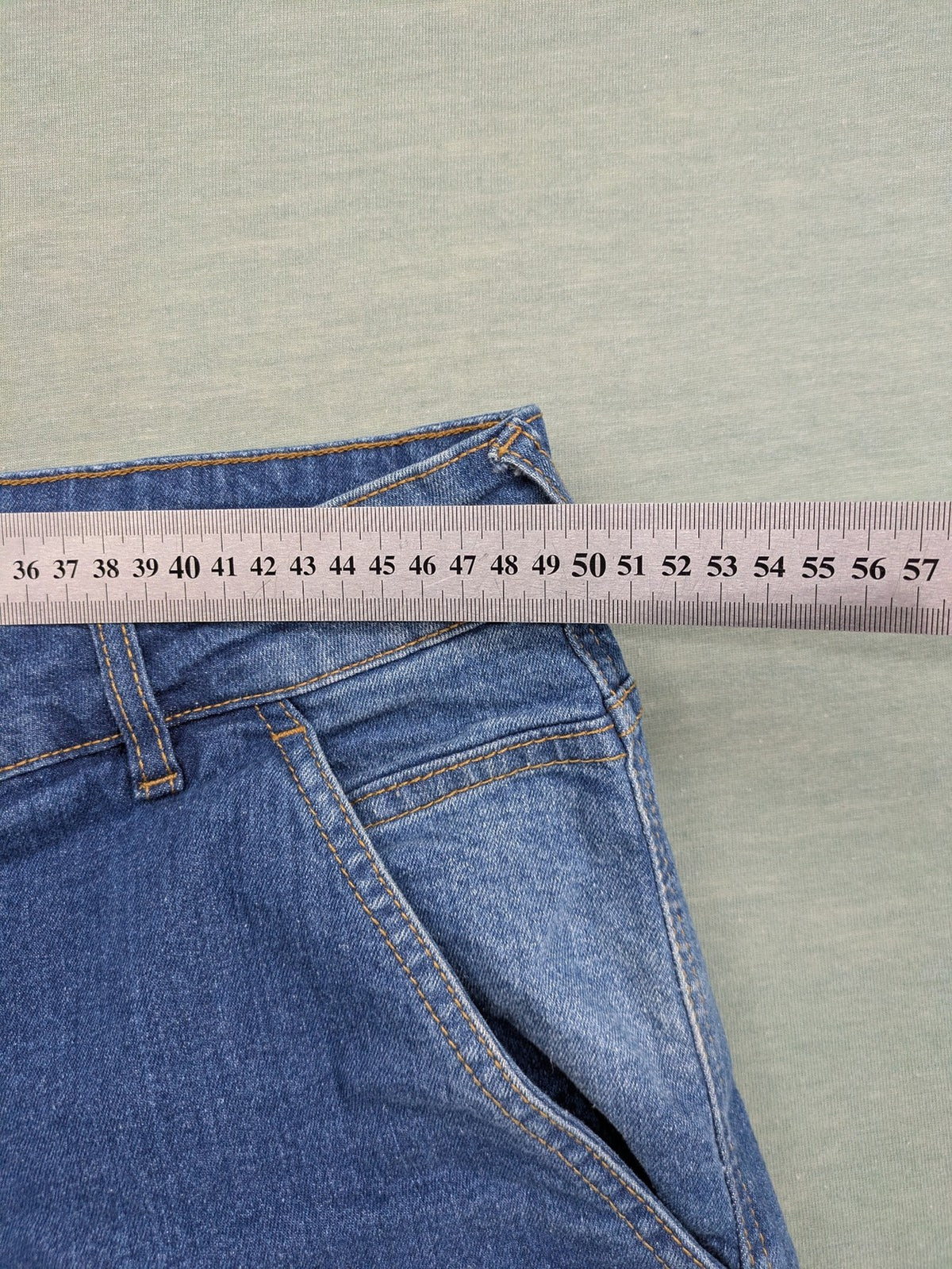 Bench blue straight jeans with reinforced knees and multiple cargo pockets.
