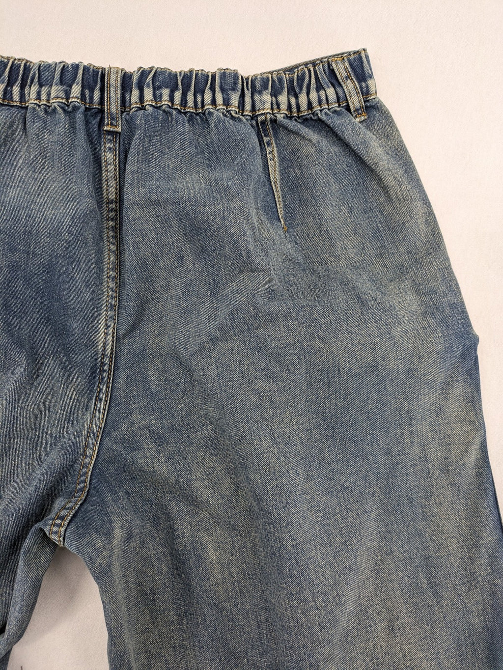 Baggy blue straight jeans wide leg with cargo pockets and elastic waistband.