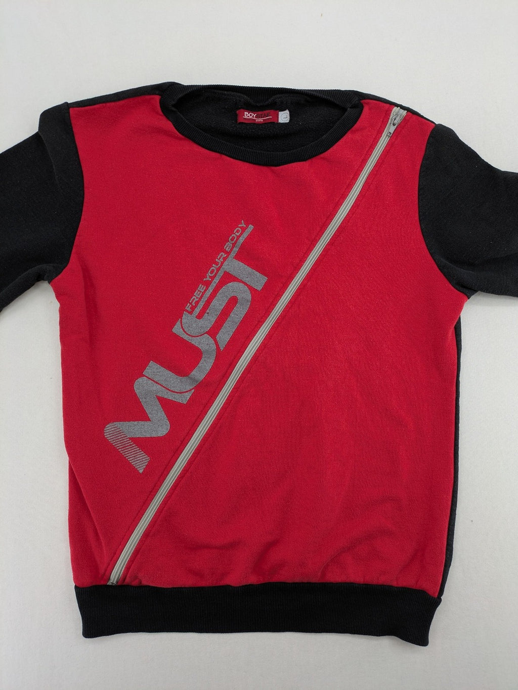 Boystar vintage turtle neck jumper red black colorblock with "MUST FREE YOUR BODY" graphic.