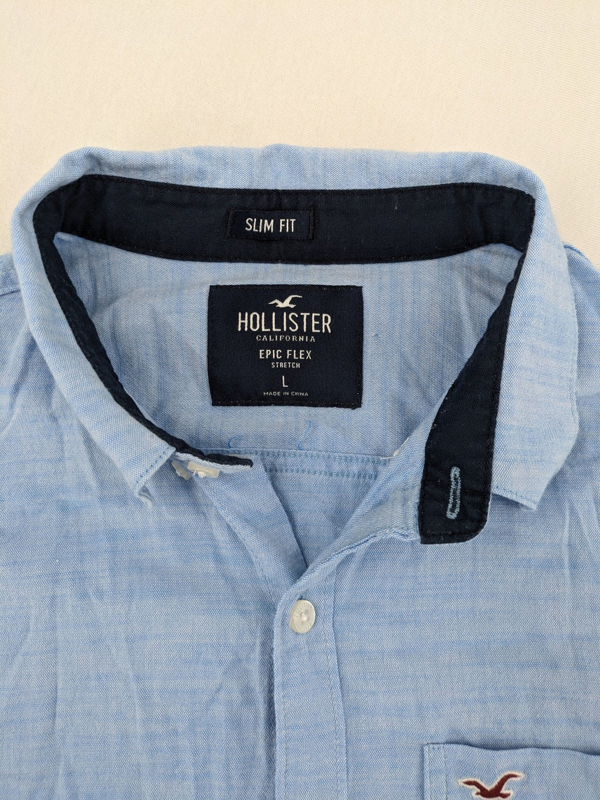 Hollister blue button-down shirt slim fit with embroidered logo and chest pocket.