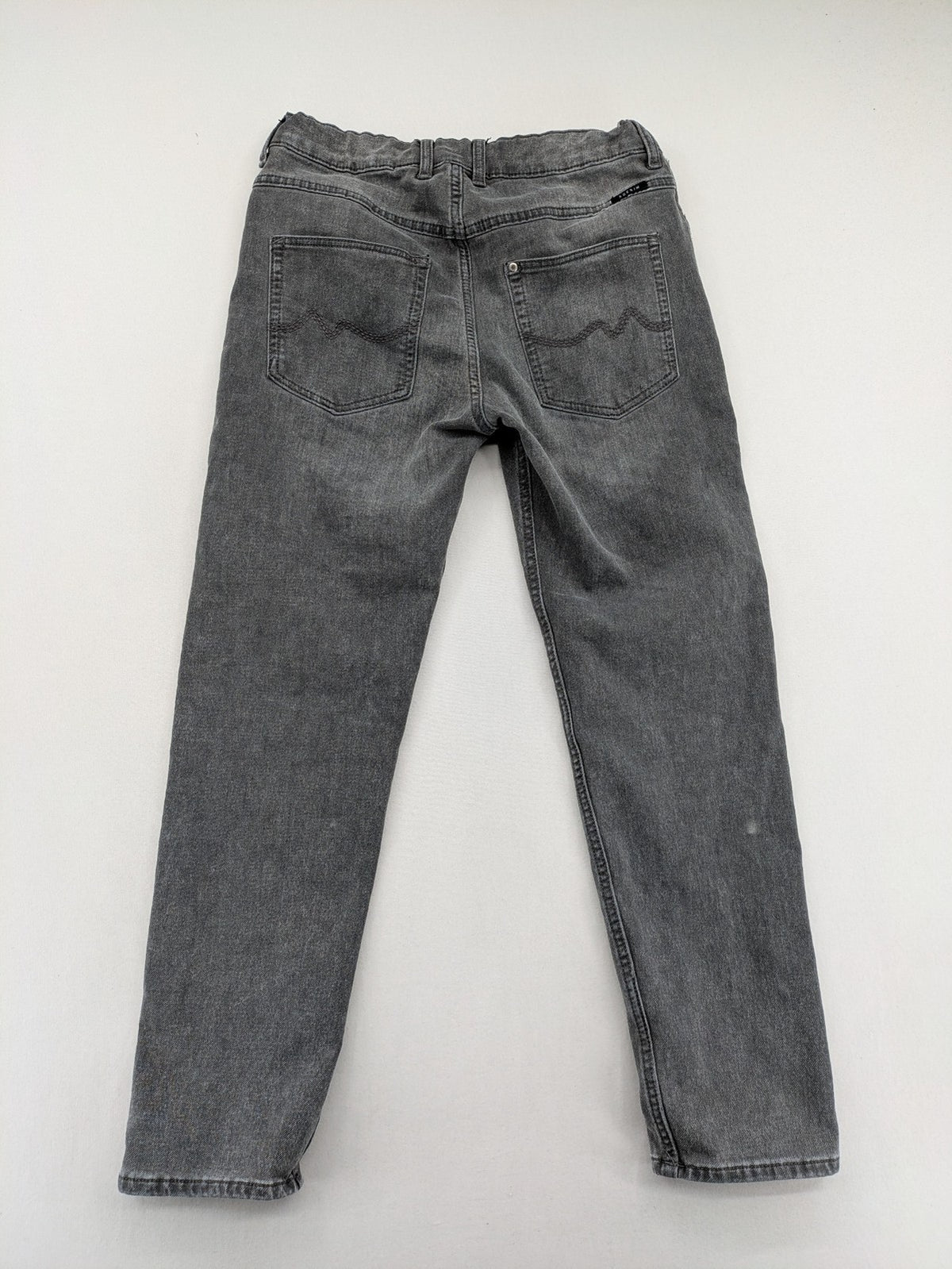H&M grey jogger jeans with elastic waistband and drawstring, stylish washed look.