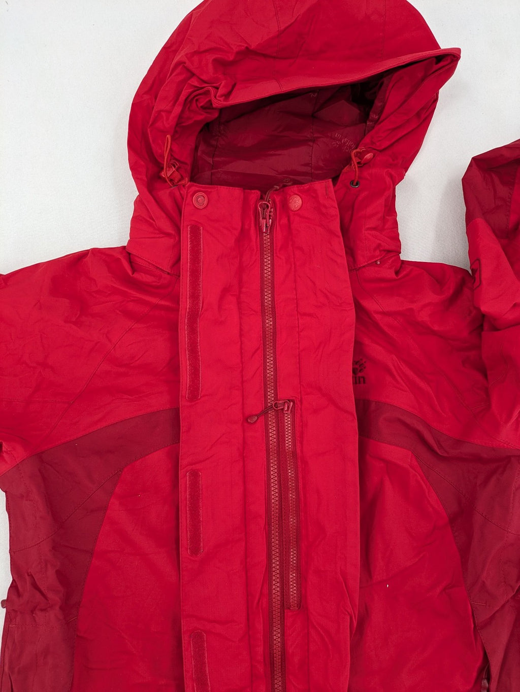 Jack Wolfskin red outdoor jacket with adjustable hood and Texapore waterproof technology